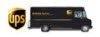 UPS delivery van with the brown and gold branding and shield logo visible on the side.